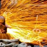 Sparks flying in close up metalworking picture