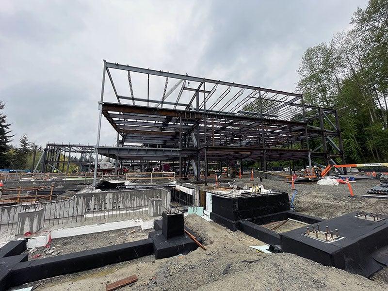 steel framing for a large building and some ground work in front of it